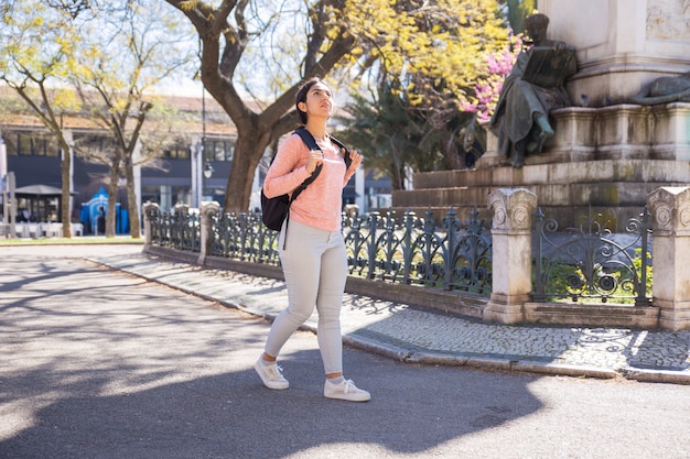 Woman walking outdoors for active recovery