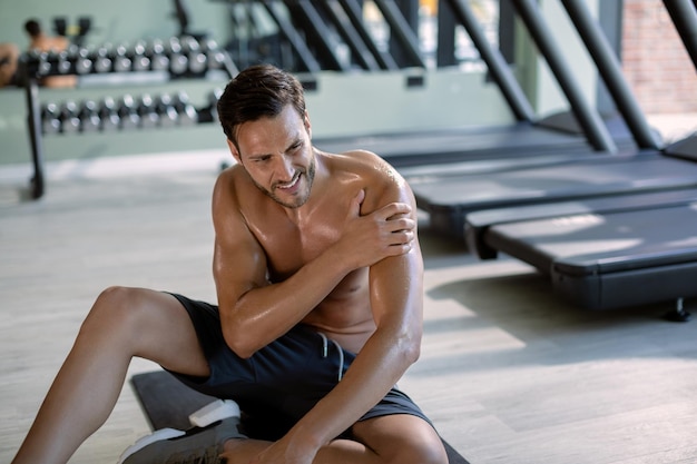 Athlete stretching and recovering post-workout