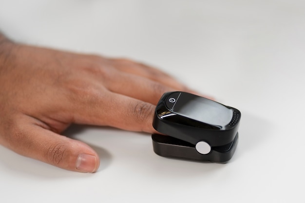 Person checking blood sugar with a glucose monitor