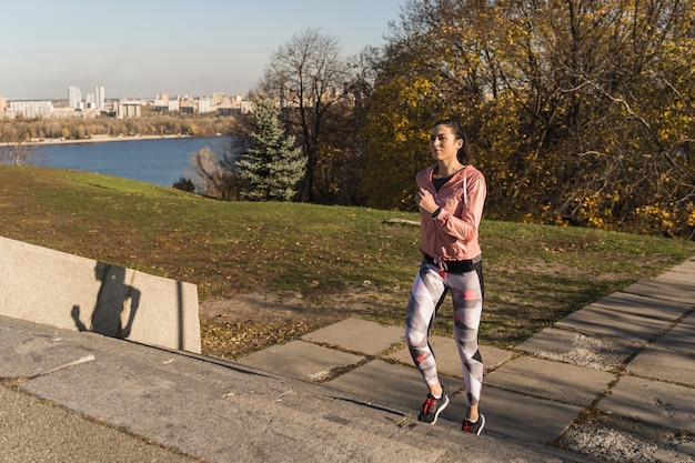 Person walking briskly in a park