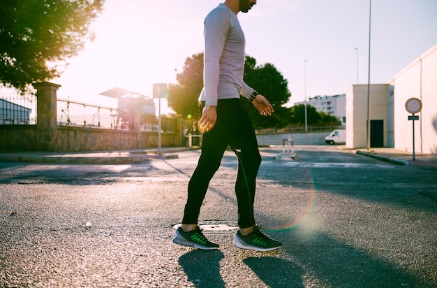 Person walking briskly in a neighborhood