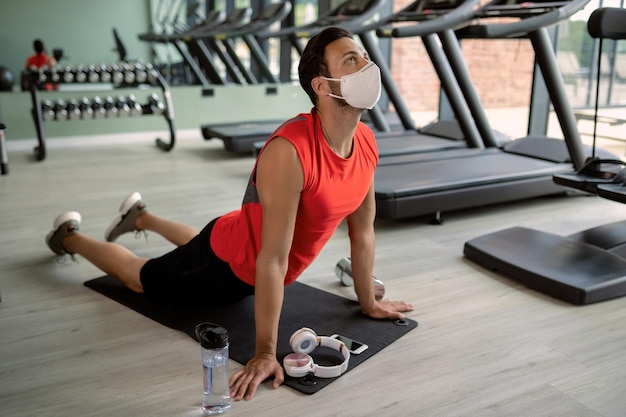 Person performing bodyweight exercises at home
