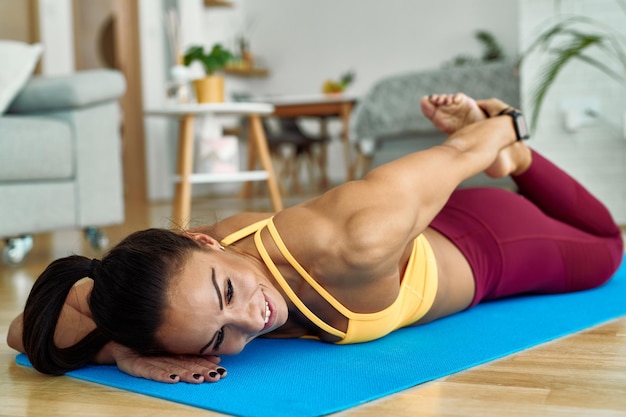 Student practicing core exercises at home