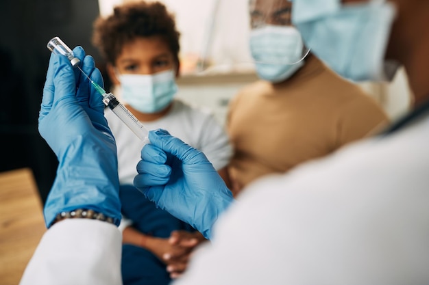 Pharmacist administering a COVID-19 booster shot at a community clinic