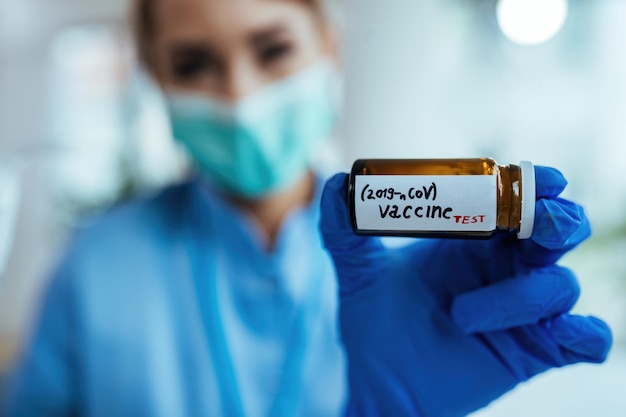 Pharmacist administering a COVID-19 vaccine at a local pharmacy