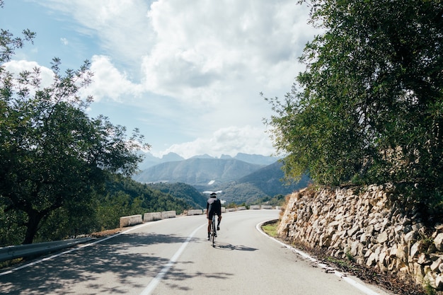 New mom cycling on a peaceful trail