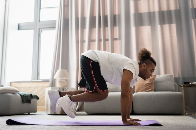 Traveler doing bodyweight exercises in a hotel room