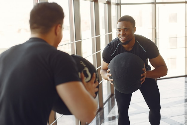 Trainer guiding senior client through low-impact exercise