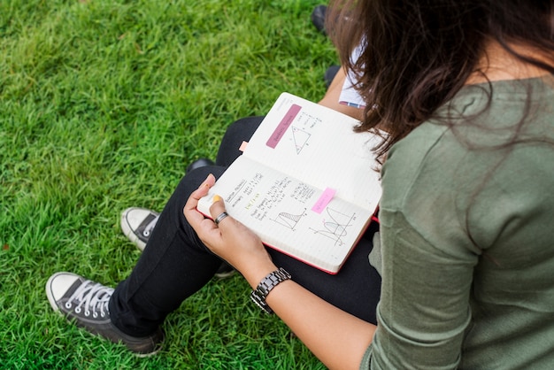 A notebook with handwritten energy levels and meal notes