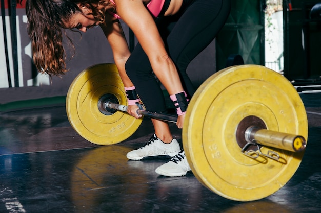 Person doing dumbbell squat at home