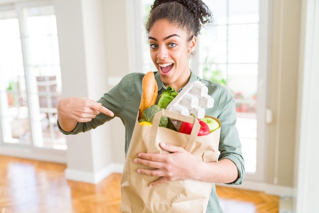 Person selecting fresh produce at the grocery store