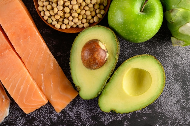 Avocado, nuts, and olive oil on a plate
