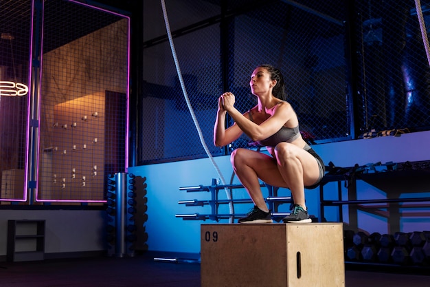 Person performing a high-intensity superset with dumbbells