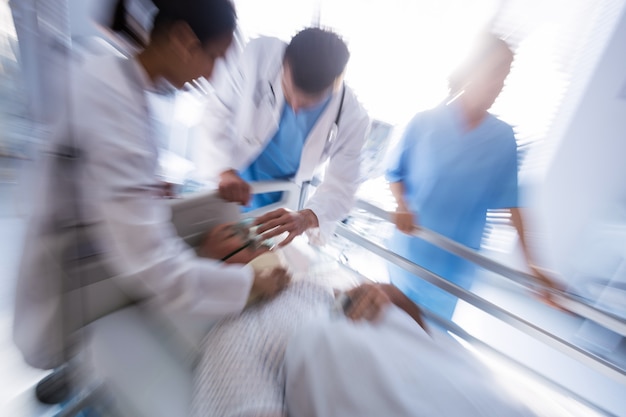 Medical team treating patient in emergency room