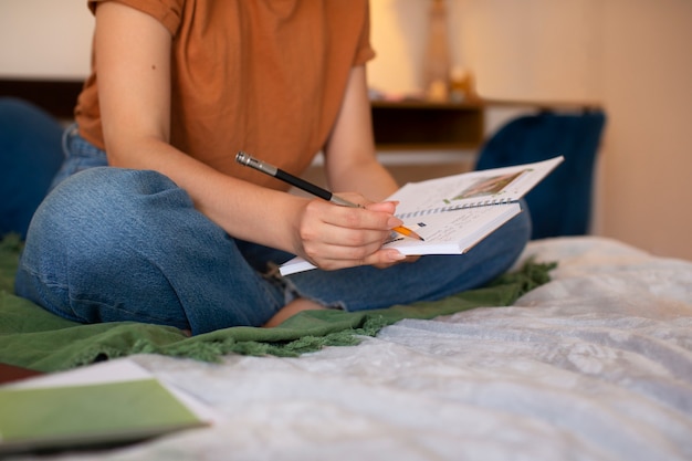 Open notebook and pen on a wooden desk