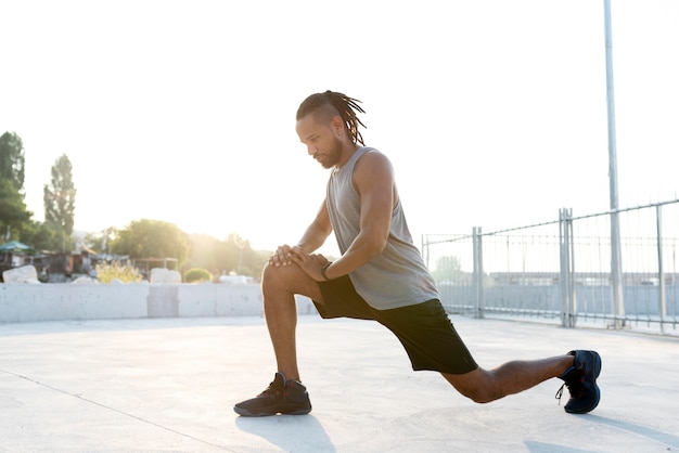 Senior performing gentle knee exercises at home