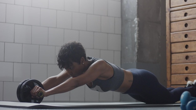 Person doing low-impact HIIT exercise on a mat