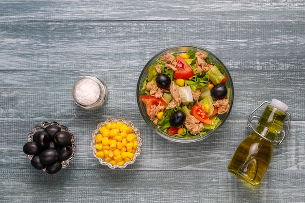 Colorful Mediterranean diet plate with vegetables, fish, olive oil, and whole grains