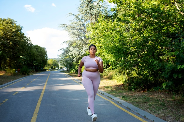 Woman walking on treadmill for metabolism boost