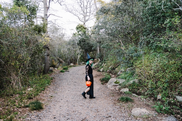 Person walking on a short nature trail near city