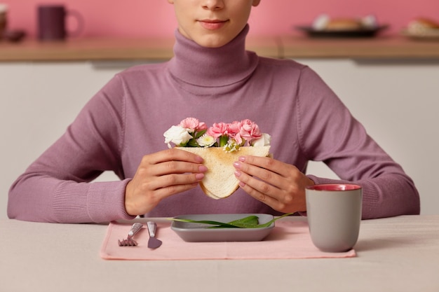 Person eating slowly and attentively at a table