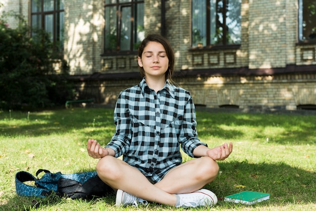 Student practicing mindfulness in bed