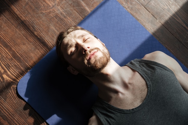 Person practicing muscle relaxation at home