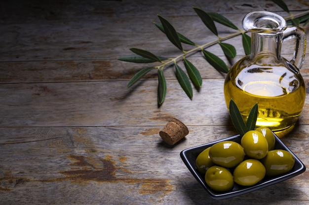 Bottle of olive oil and fresh herbs