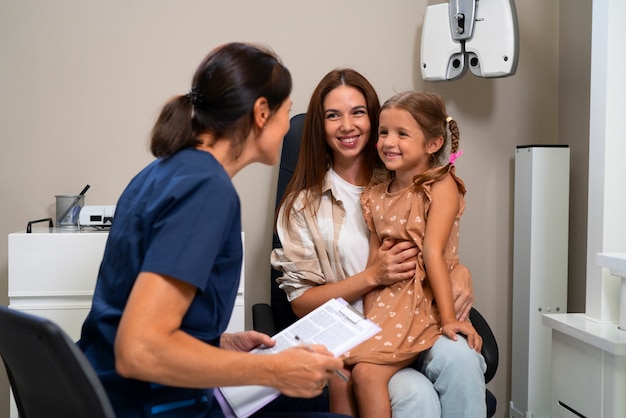 Parents consulting healthcare providers about children's vaccines