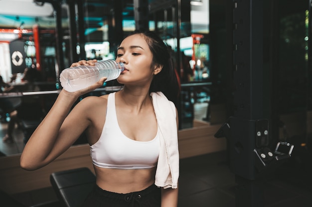 Person drinking water after a workout