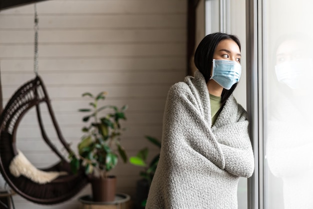 Person wearing a mask in an indoor public setting