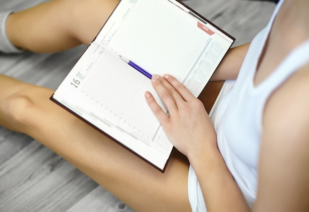 Pilates habit tracker on a notebook