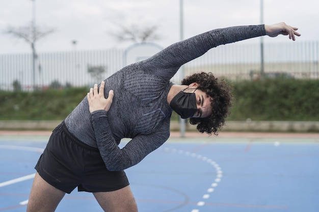 Runner stretching arms and shoulders