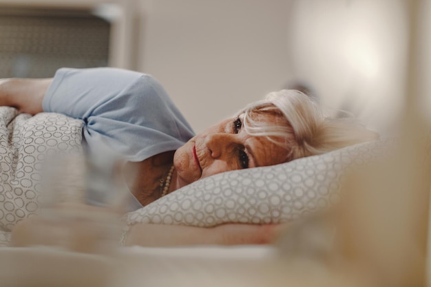 Woman sleeping peacefully in a dark room