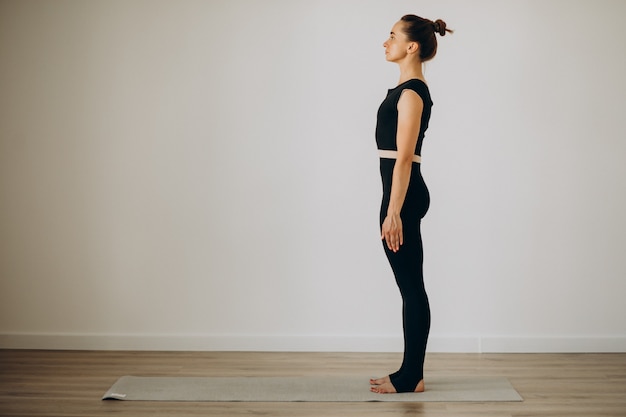 Person practicing wall posture alignment