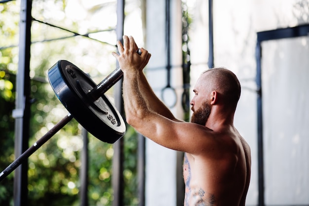 Man performing bodyweight strength training at home