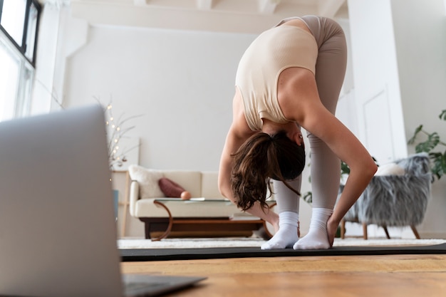 Senior stretching gently at home