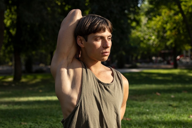Teen stretching in a park