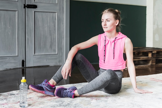 Teen doing squats at home