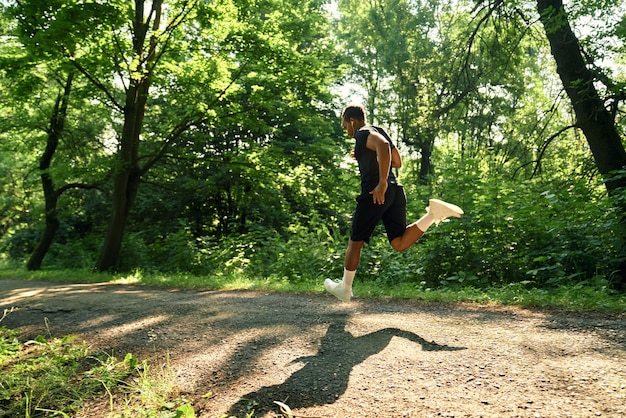 Runner enjoying forest trail