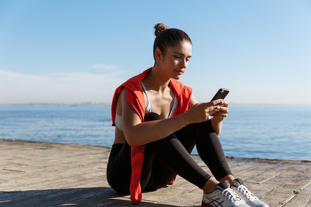 Person tracking health metrics on a smartphone while traveling
