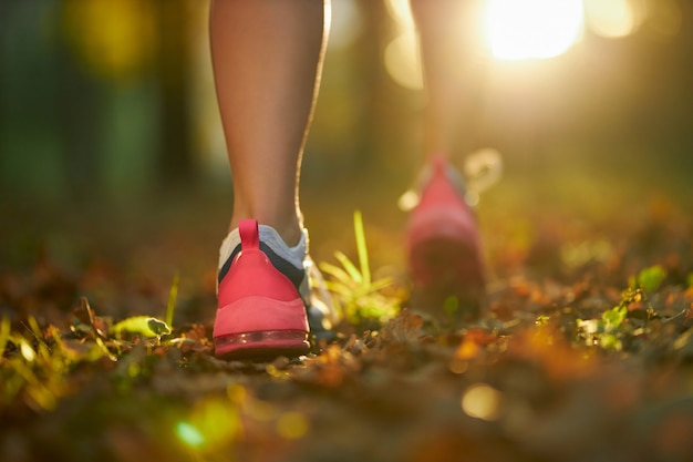 Person walking on a trail for active recovery