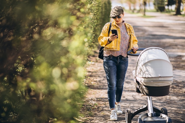 New mom walking with baby in stroller