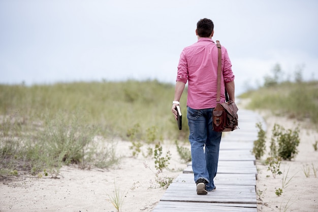 Traveler walking briskly through a city