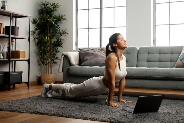 Person warming up with arm circles at home