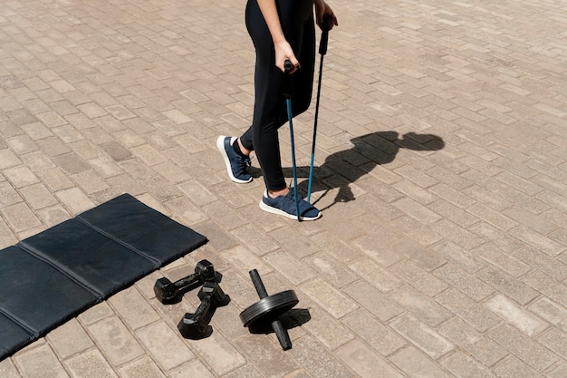 Person walking uphill wearing a weighted vest