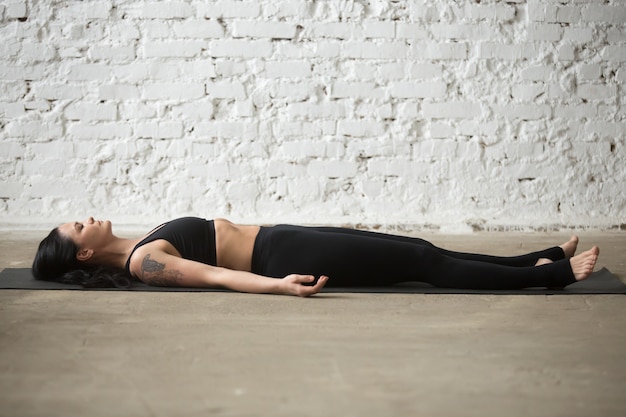 Yoga relaxation pose on mat
